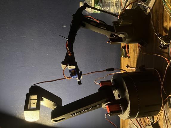 Physical builds of DUNCE MKII on the left and DUNCE MKI on the right, standing on a workbench